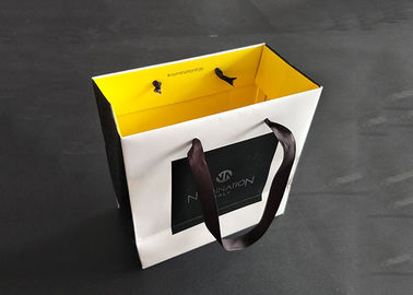 China Black And White Branded Paper Bags With Ribbon Handle Quality Assured Corrugated factory