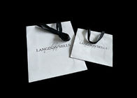 Reusable OEM Medium White Paper Shopping Bags Promotional CMYK Garment Carry supplier